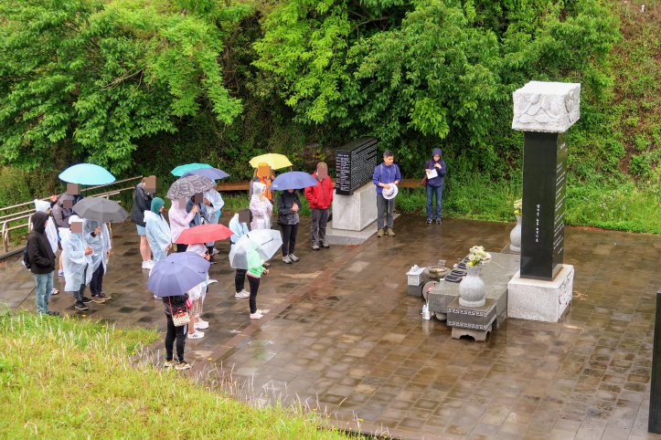 At moment of silence at the victims’ memorial at Seodal Oreum.